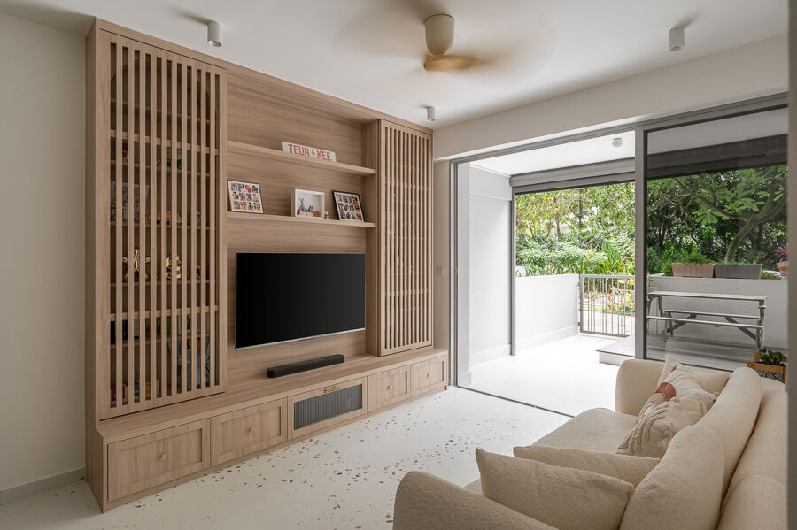 A slim timber screen divides living from balcony without taking the daylight. — Prive, Punggol Field